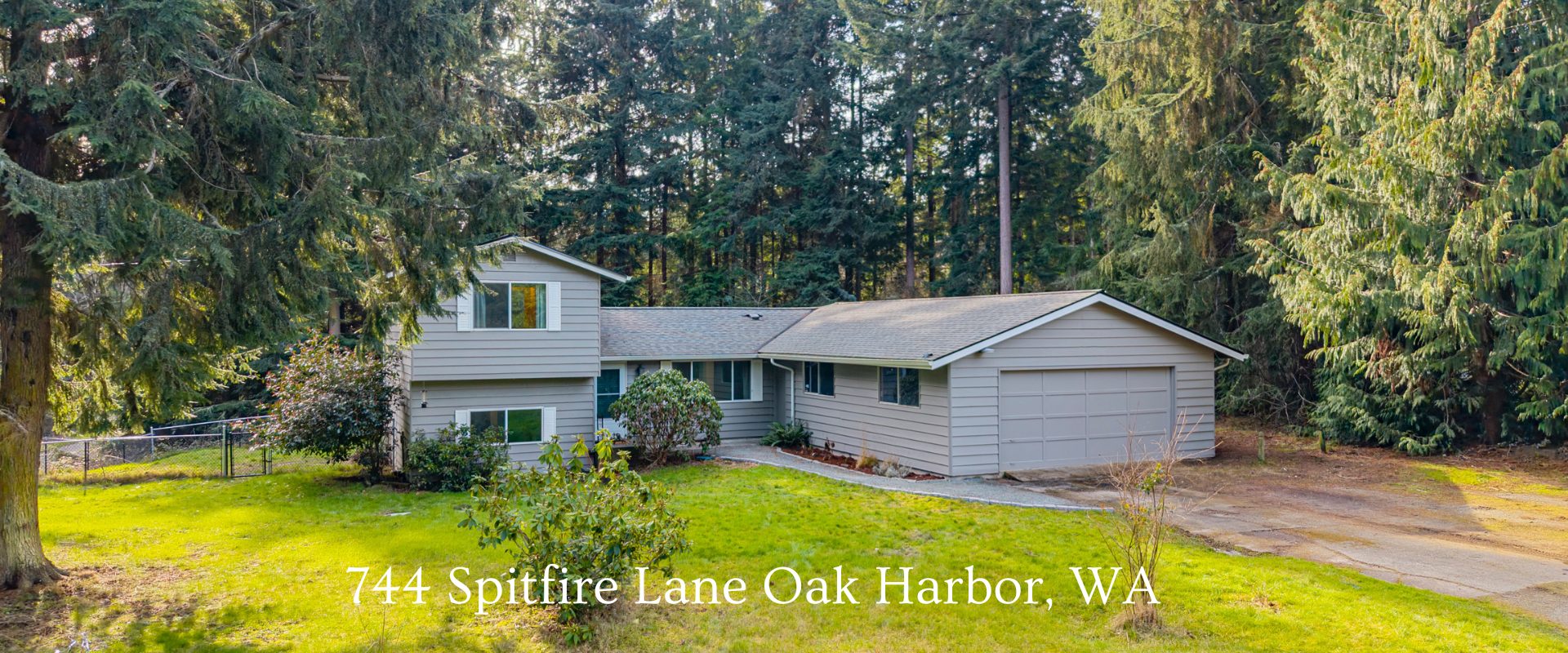 Tri-level home on 1.25 acres in Oak Harbor WA with fenced yard, surrounded by trees, near NAS Whidbey Island